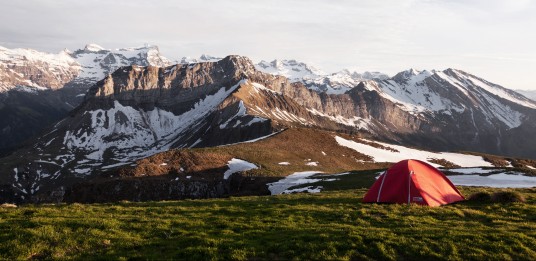 Tent in the mountains during winter, photo by Dino Reichmuth on Unsplash