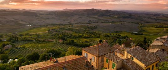 tuscan landscape under pink sky