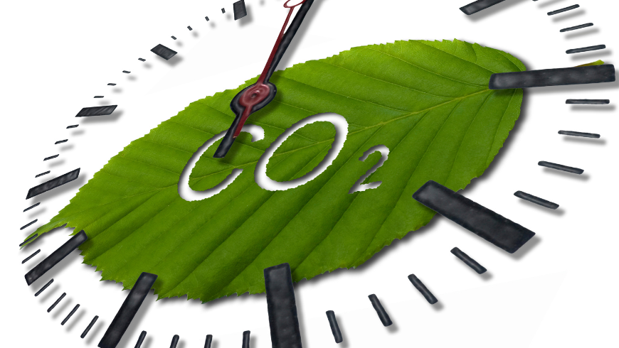 Orologio con lancetta intorno a una foglia verde con la scritta CO₂