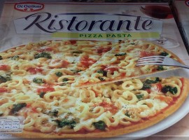 Box of frozen pizza with pasta topping
