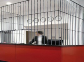 Reception in a cage at Alcatraz hotel