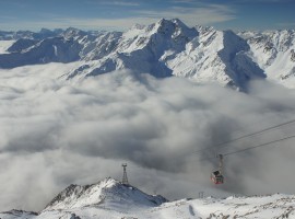 a chair lift in Val Senales, on the background a snowy mountain chain