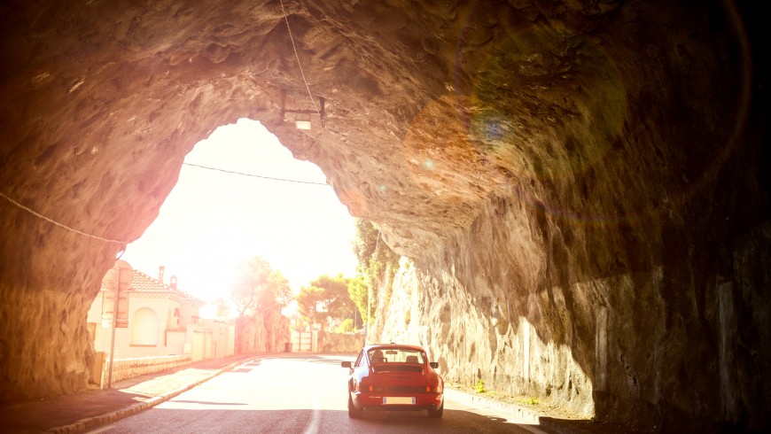 Car on a historic road in Italy