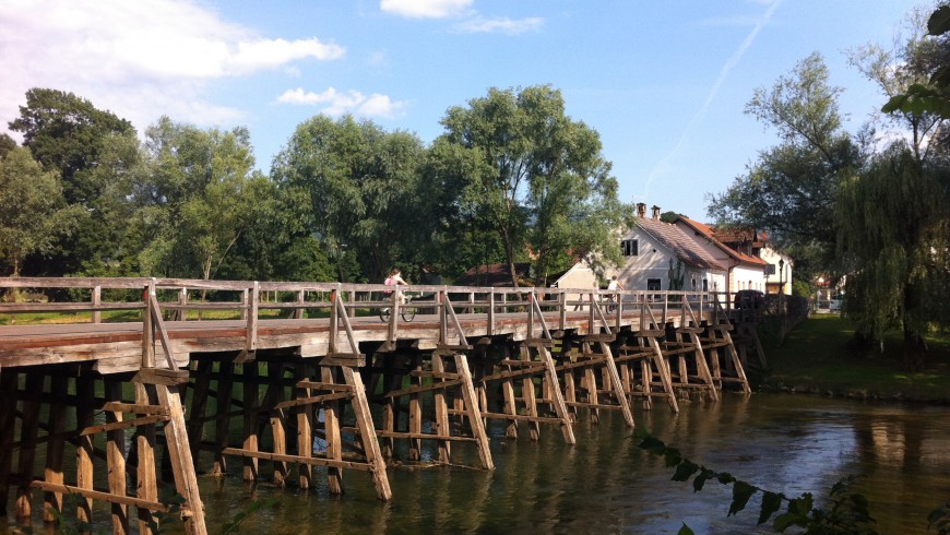 Kostanjevica na Krki, small wood bridge only for pedestrians to reach the historic old part of the town.