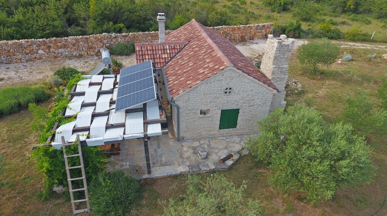 Aerial view on the house, with the solar panels on the roof