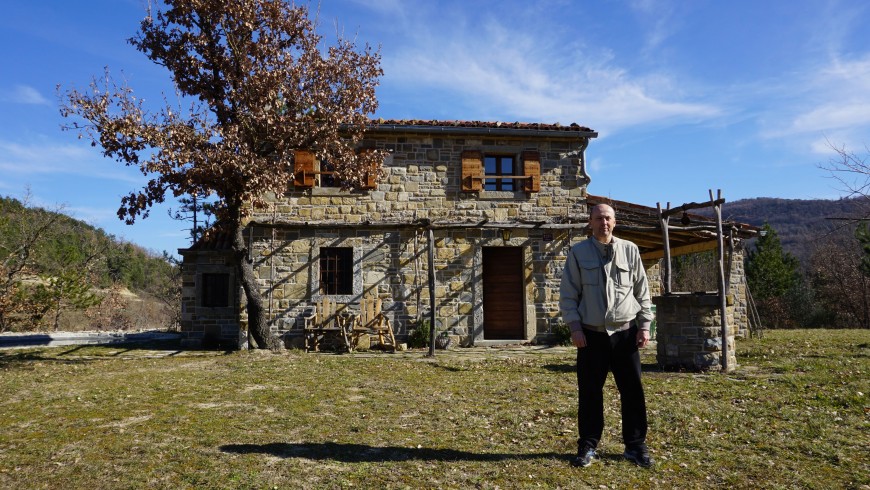 The owner in front of the house