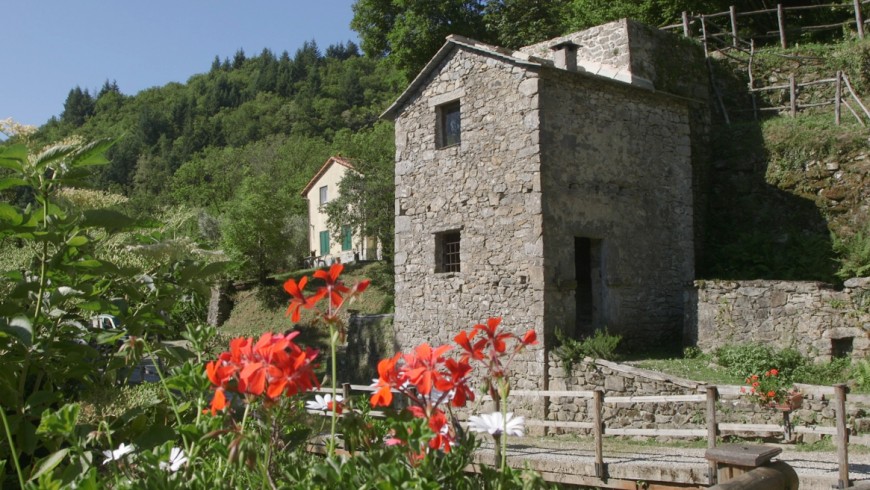 The unique structure of the Belpiano mill, with the "tower", seen from outside. Aveto Park, Liguria, Italy