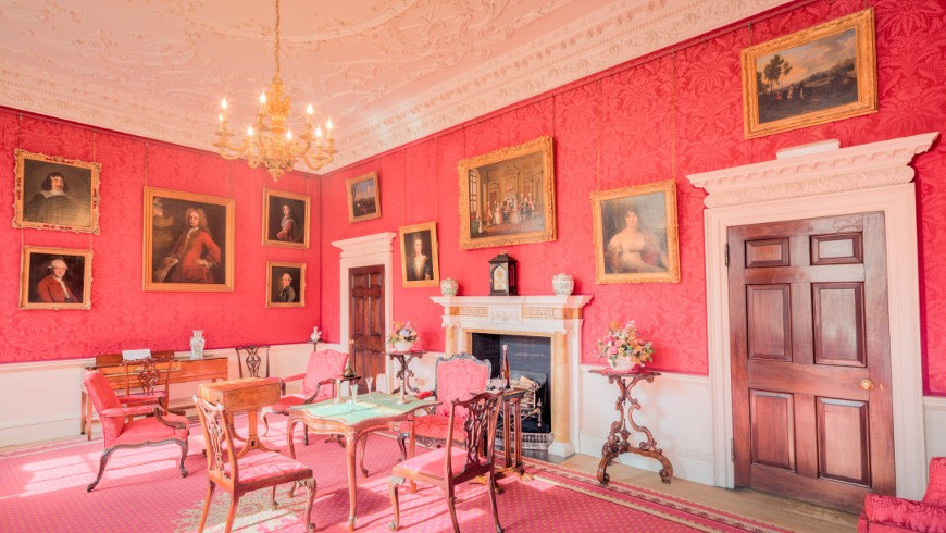 Interioir design of the Fairfax House, with tables, chairs, cheminy, paints and pink walls