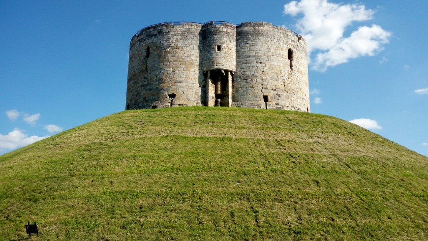 Clifford's tower on the top of a green hill 