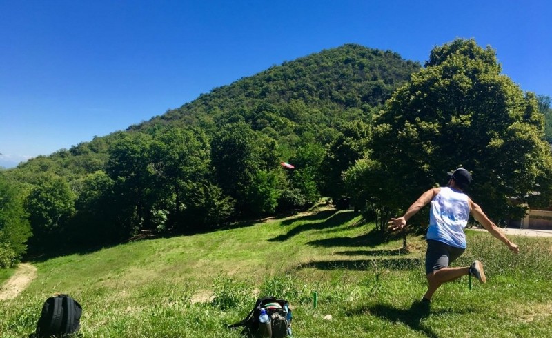 Boy playing Disc Golf in the Euganean Hills, near Padova