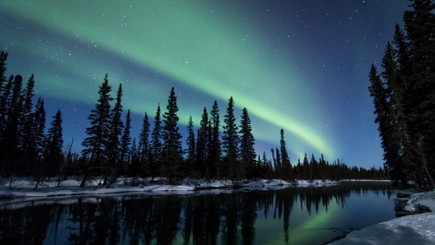 blue and green northern lights in lapland