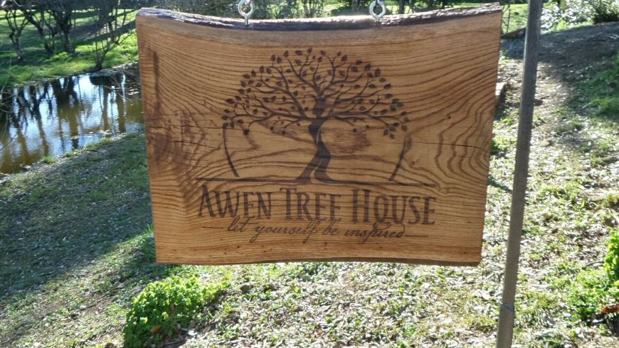 awen treehouse logo on wooden piece
