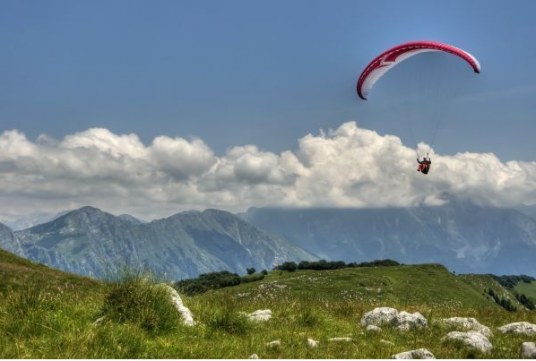 Paragliding while glamping in Slovenia