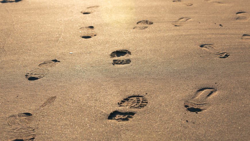 footprints on the sand, a metaphor of carbon footprint