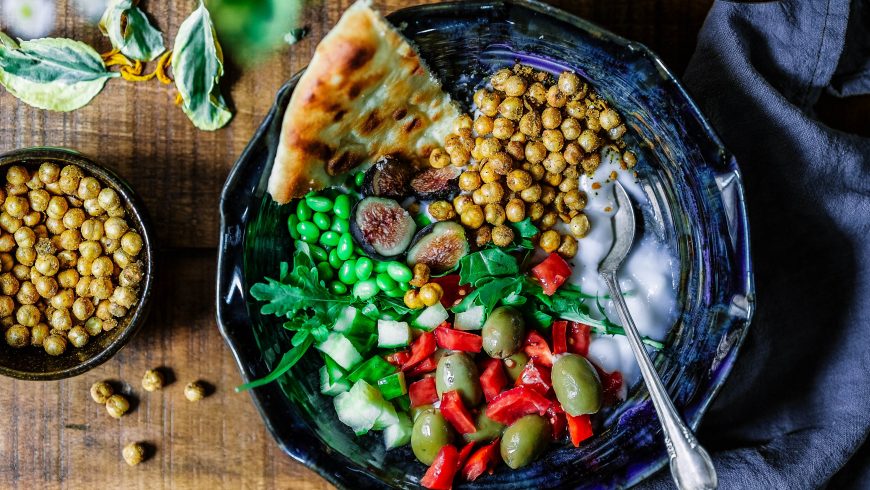 Vegan salad with chickpeas, olives and tomatoes