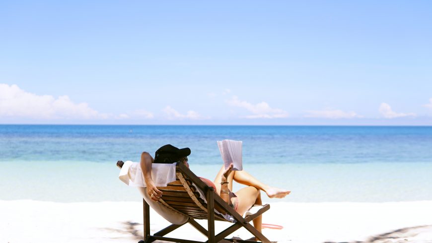 Woman reading on a beach