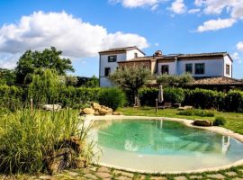 the sustainable tourism accommodation Coroncina with its pool