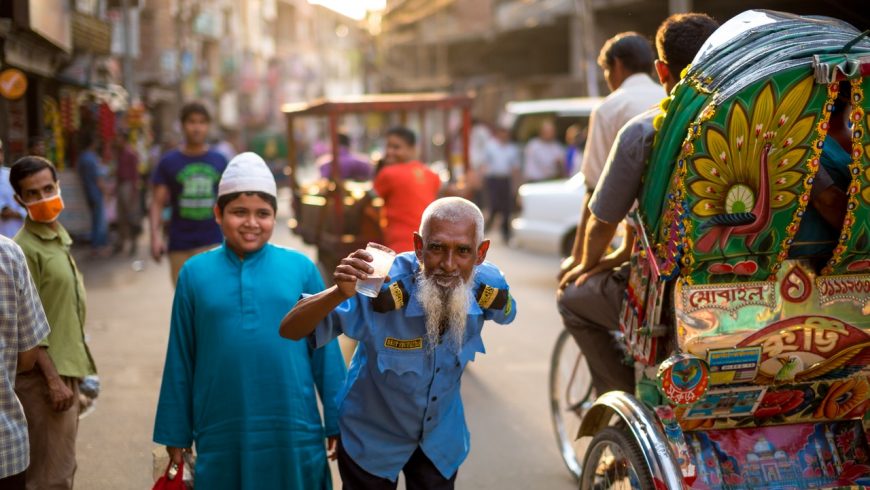 man standing beside boy