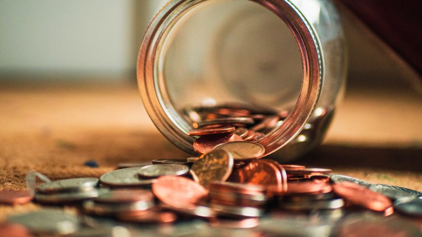 A jar of coins spilling out