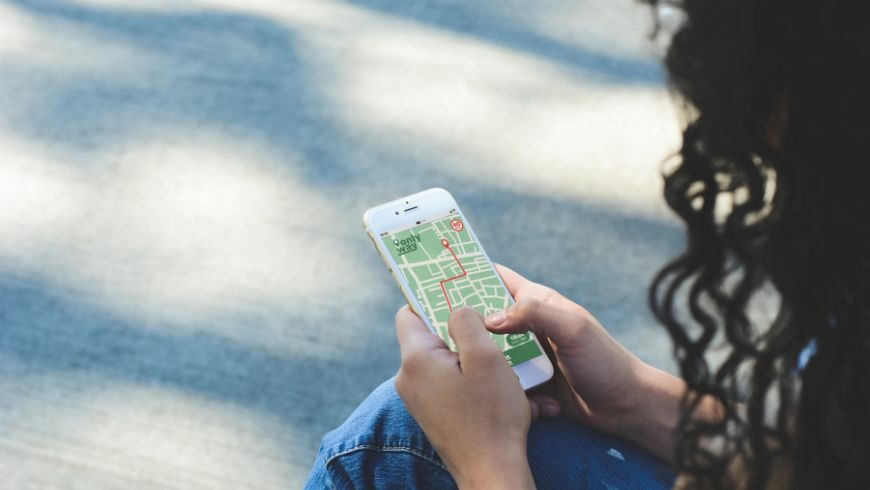 girl using an app to find the most eco-friendly route