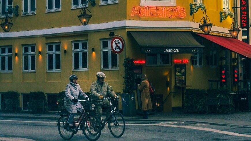 Two people on bicycles touring Copenhagen