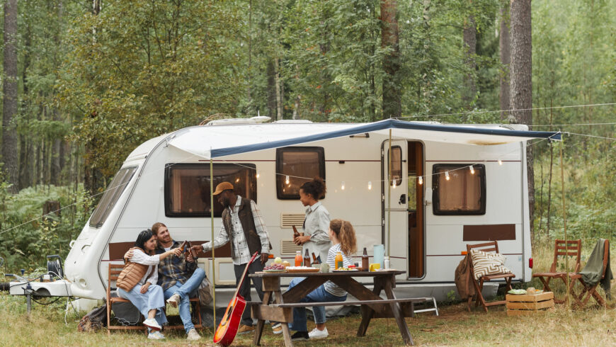 Group of Friends Relaxing by RV Van