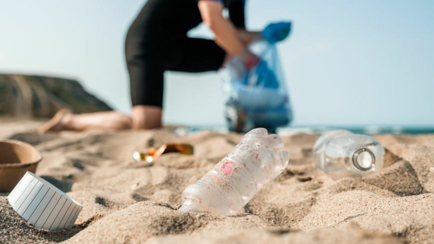 collecting trash on the beach