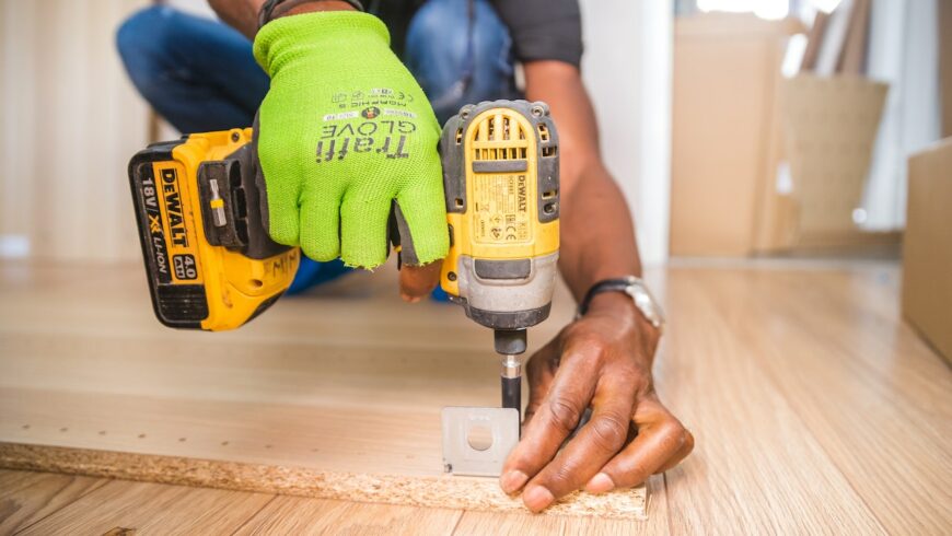 A man installing a wooden floor