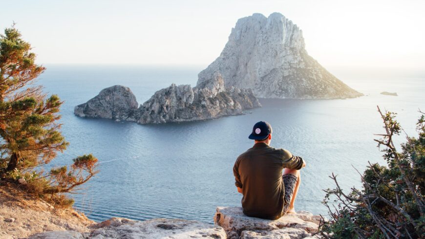 Tourist relaxing by admiring the coastal landscape