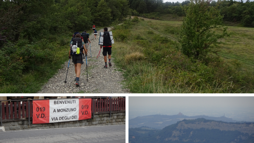 walking on the gravel road, sign in Monzuno and the basilica in the far distance