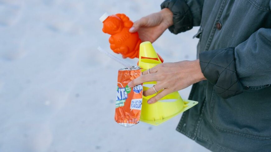 A woman collecting plastic garbage on the beach