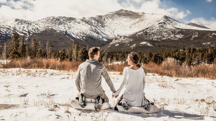 Couple enjoying the snowy mountain view in Colorado