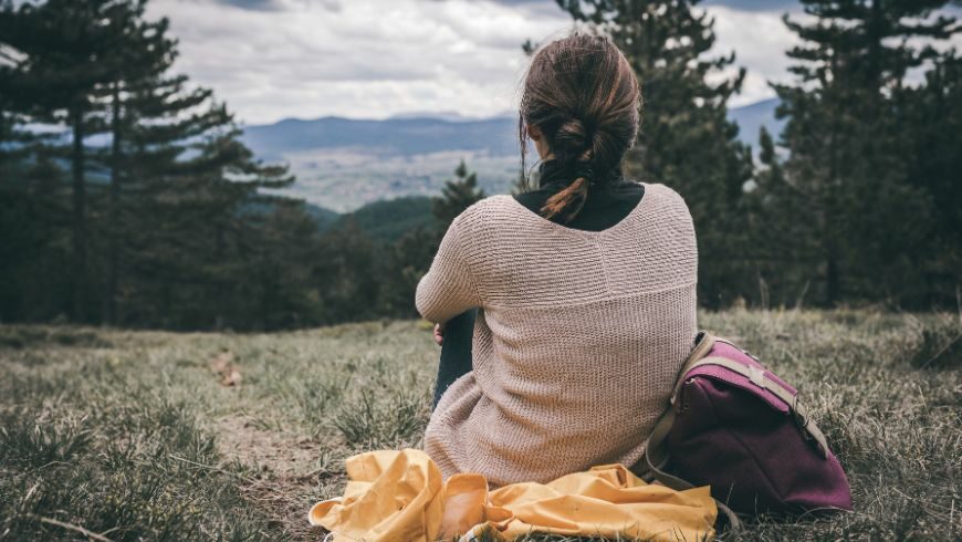 Person sitting quietly in nature