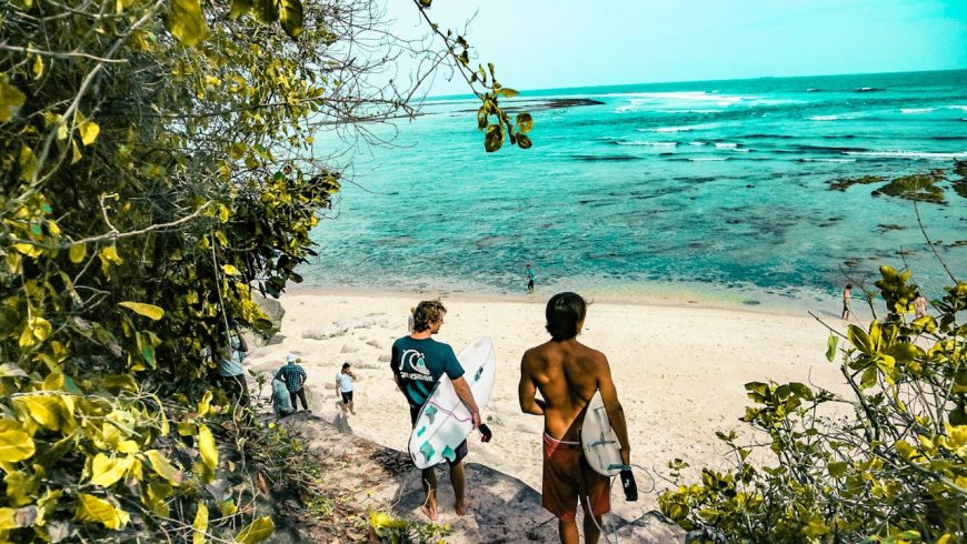 two men holding surfboards, surfing, blue sea, natural landscape