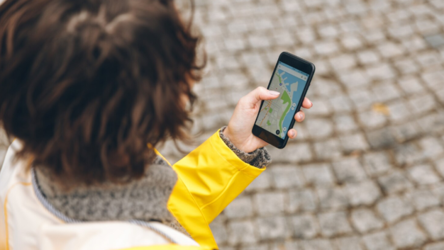 a traveller using the mobile phone and staying connected abroad