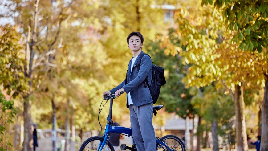 student going by bike to the campus