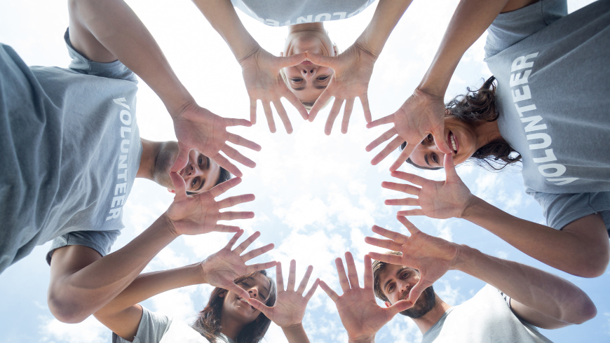Happy volunteers playing with their hands