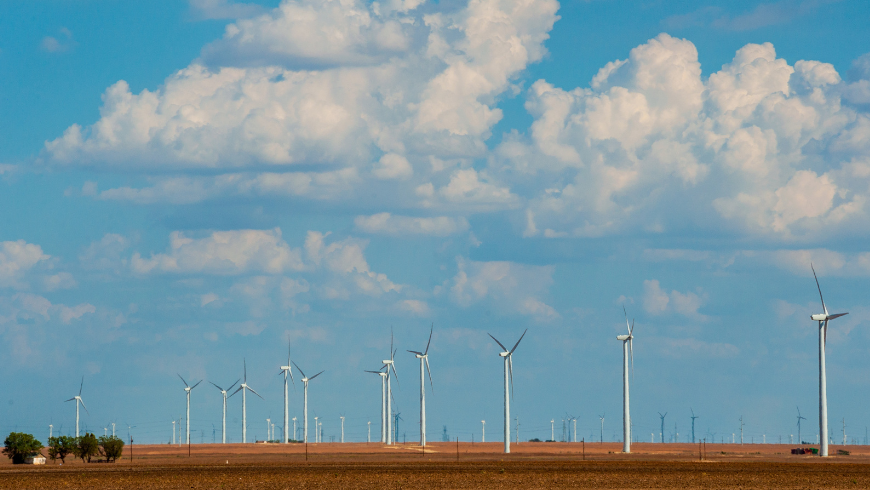 Row of Wind Turbines Summer West Texas Wind Farm: fields of wind turbines stretching to the horizon