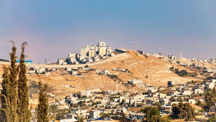 View of Small Village and the Israeli West Bank Barrier