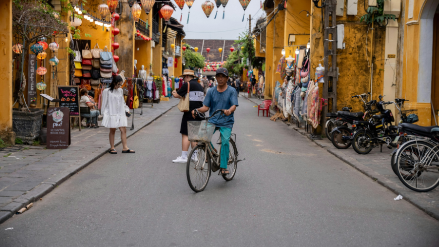 Man on a bike in the Old Town, Hoi An, Vietnam