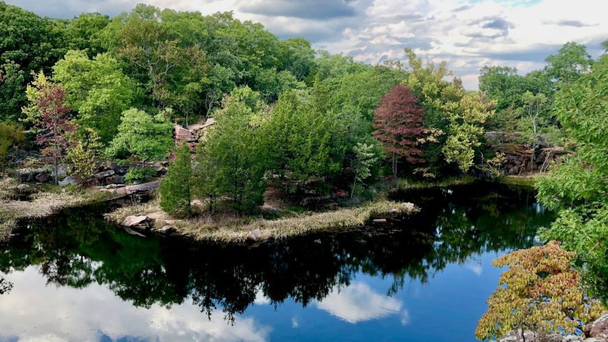 River in Elephant Rock State Park, Ozarks, Missouri, greenery, trees, sky with white clouds