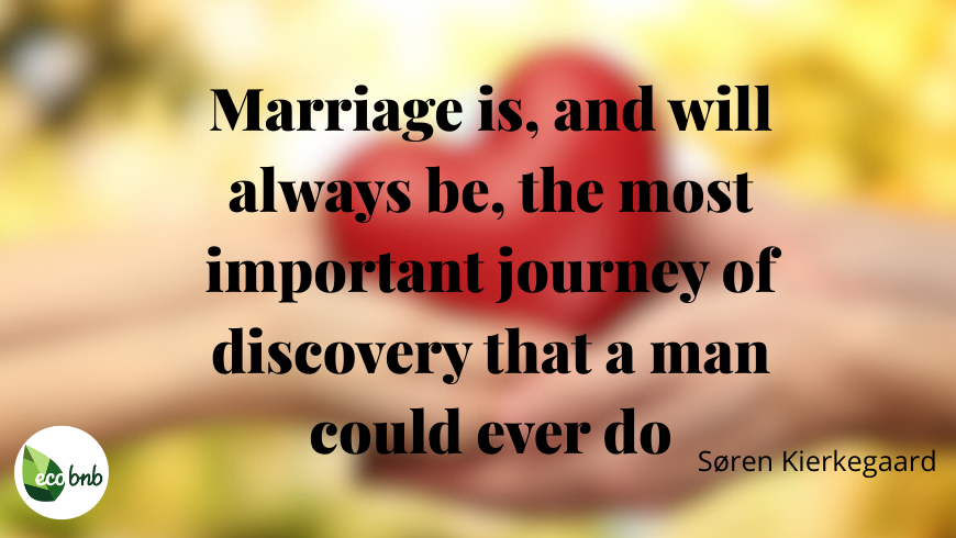 Marriage quote by Søren Kierkegaard in elegant black typography over a warm, softly blurred natural background featuring a red heart held between two hands, with Eco BnB logo.