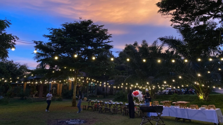 Sunset time in a hotel with dinner table and lights
