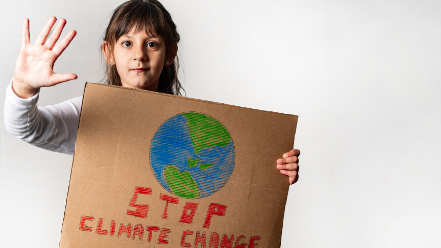 Girl holding stop climate change sign raising awareness about the climate crisis