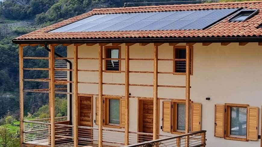 sustainable house with solar panels representing renewablem energy and eco friendly living