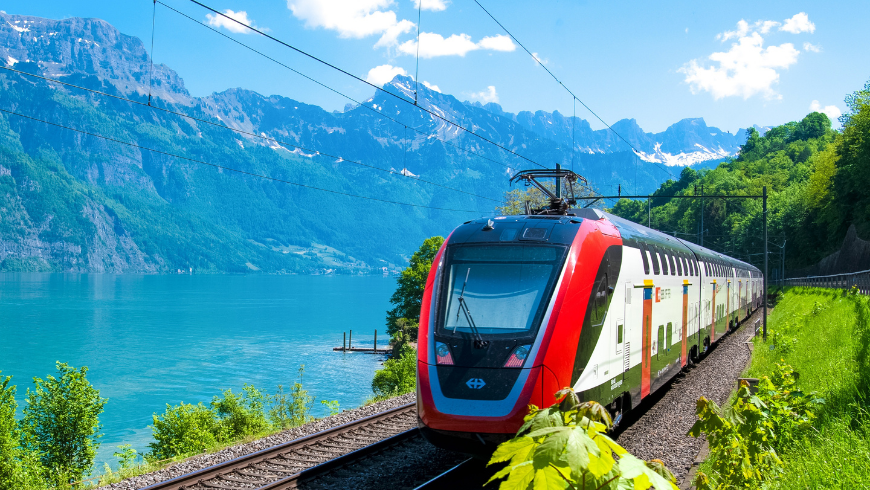 train travelling through nature representing sustainable transport and low impact travel