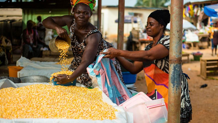 A Woman Sells Fish At The Makola Market In Accra, Ghana
