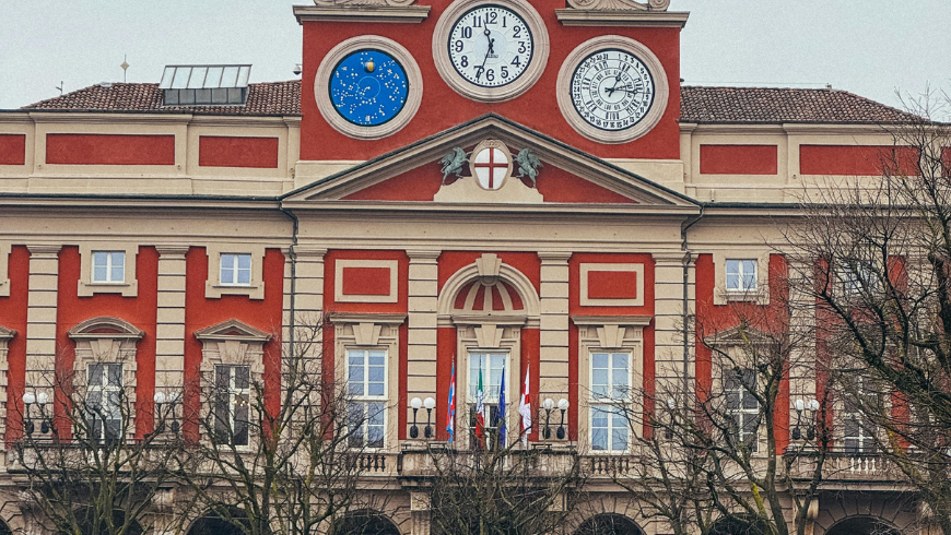 Facade of Palazzo Rosso and the three clocks