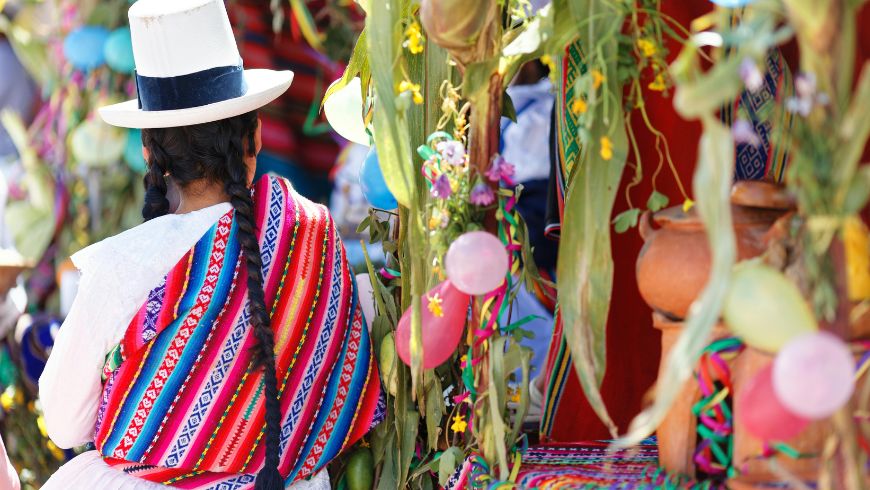 Woman dressed in traditional Quechua attire in Cusco, Peru