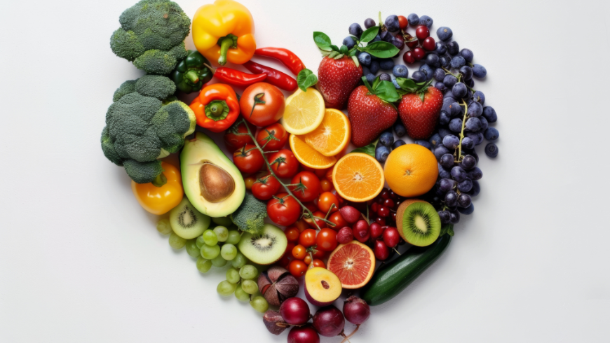 Heart made of fresh fruits and vegetables, symbolizing healthy, natural, and sustainable eating.